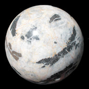 Big Zebra Stone sphere 147mm 4780g in sunlight - Rocks and Things Store