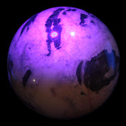 Big Zebra Stone sphere 147mm 4780g in UV light - Rocks and Things Store
