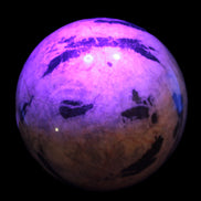 Big Zebra Stone sphere 147mm 4780g in UV light - Rocks and Things Store