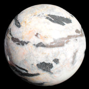 Big Zebra Stone sphere 147mm 4780g in sunlight - Rocks and Things Store