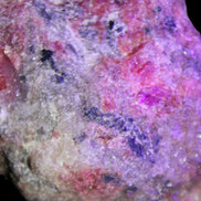 Natural Rhodonite specimen 120*81*50mm 700g in UV light - Rocks and Things Store