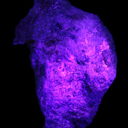 Natural Rhodonite specimen 120*81*50mm 700g in UV light - Rocks and Things Store