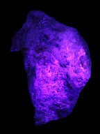 Natural Rhodonite specimen 120*81*50mm 700g in UV light - Rocks and Things Store