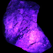 Natural Rhodonite specimen 120*81*50mm 700g in UV light - Rocks and Things Store