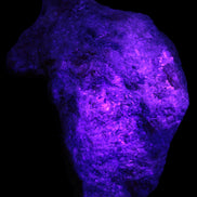 Natural Rhodonite specimen 120*81*50mm 700g in UV light - Rocks and Things Store