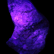 Natural Rhodonite specimen 120*81*50mm 700g in UV light - Rocks and Things Store