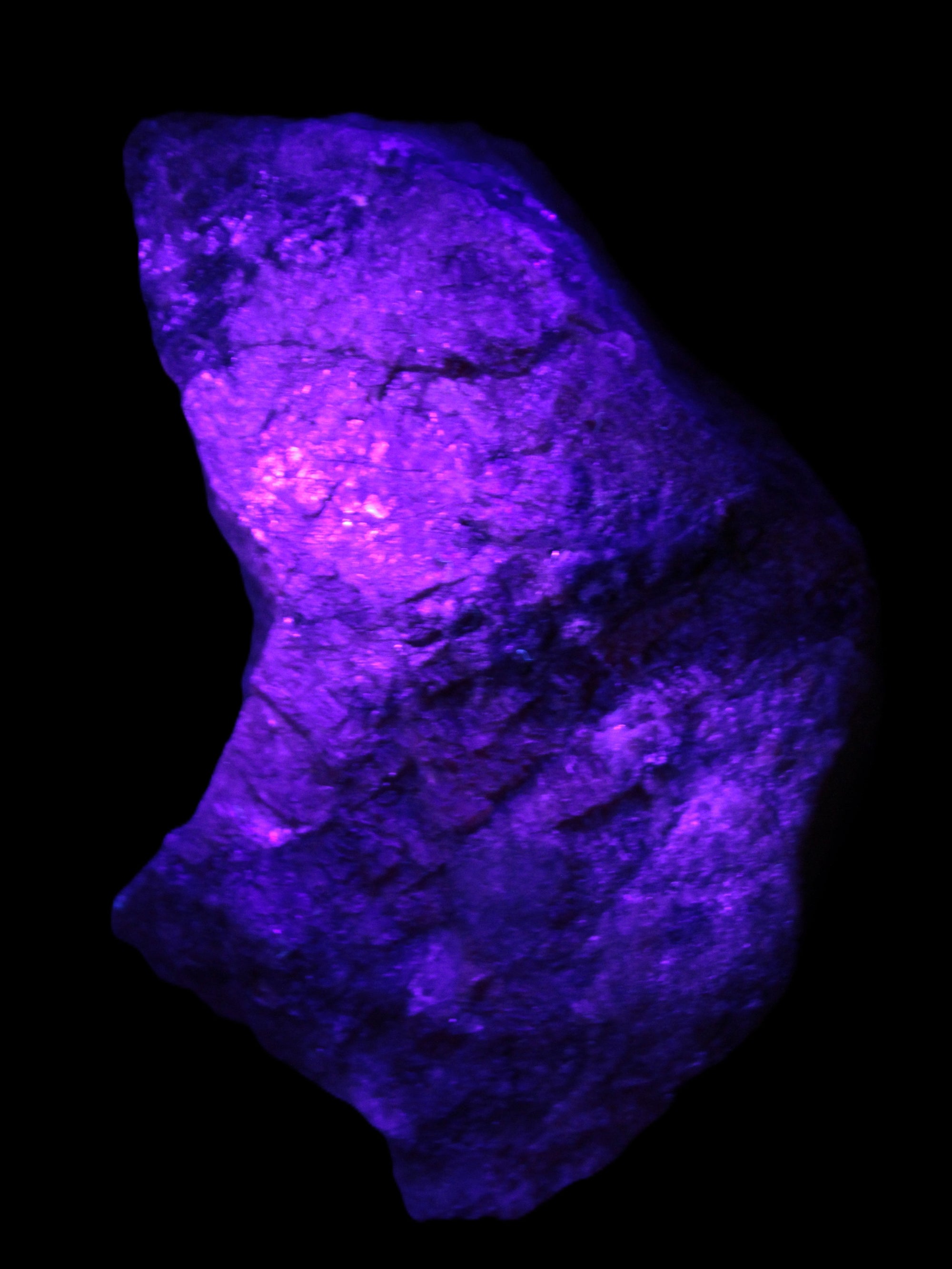 Natural Rhodonite specimen 120*81*50mm 700g in UV light - Rocks and Things Store