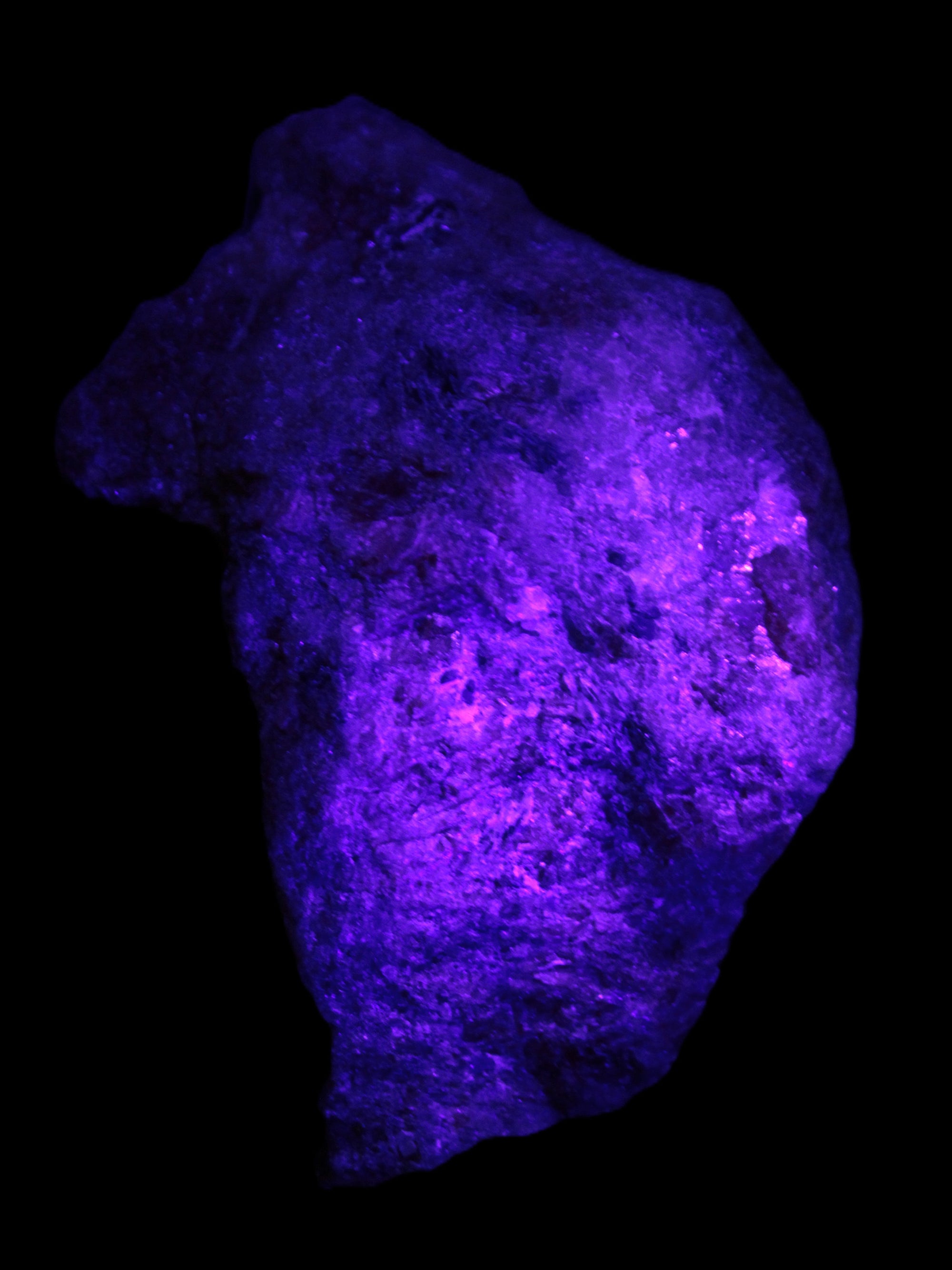 Natural Rhodonite specimen 120*81*50mm 700g in UV light - Rocks and Things Store