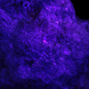 Natural Rhodonite specimen 120*81*50mm 700g in UV light - Rocks and Things Store