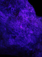 Natural Rhodonite specimen 120*81*50mm 700g in UV light - Rocks and Things Store