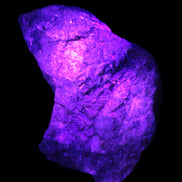 Natural Rhodonite specimen 120*81*50mm 700g in UV light - Rocks and Things Store