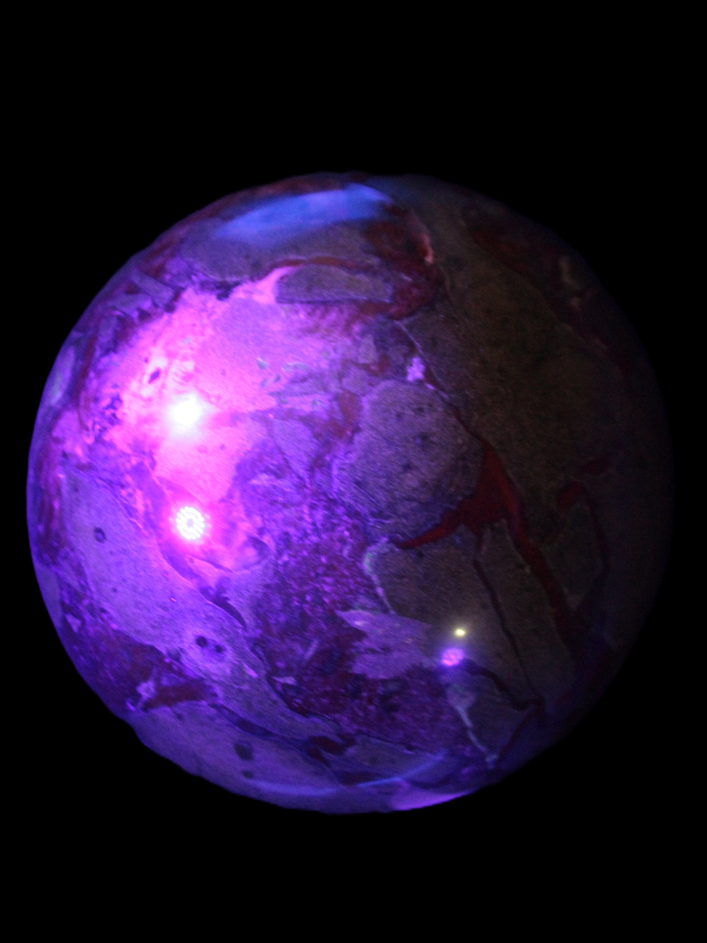 Huge Dragons Blood Stone sphere 164mm 7040g in UV light