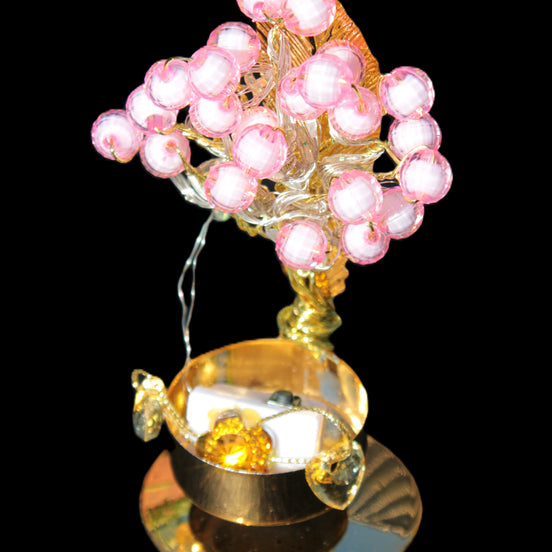 Mesmerising Handmade Golden Iron stand with pink crystal beads and lights from Jordan in sunlight - Rocks and Things Store