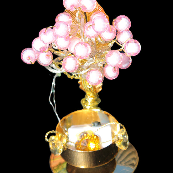Mesmerising Handmade Golden Iron stand with pink crystal beads and lights from Jordan in sunlight - Rocks and Things Store