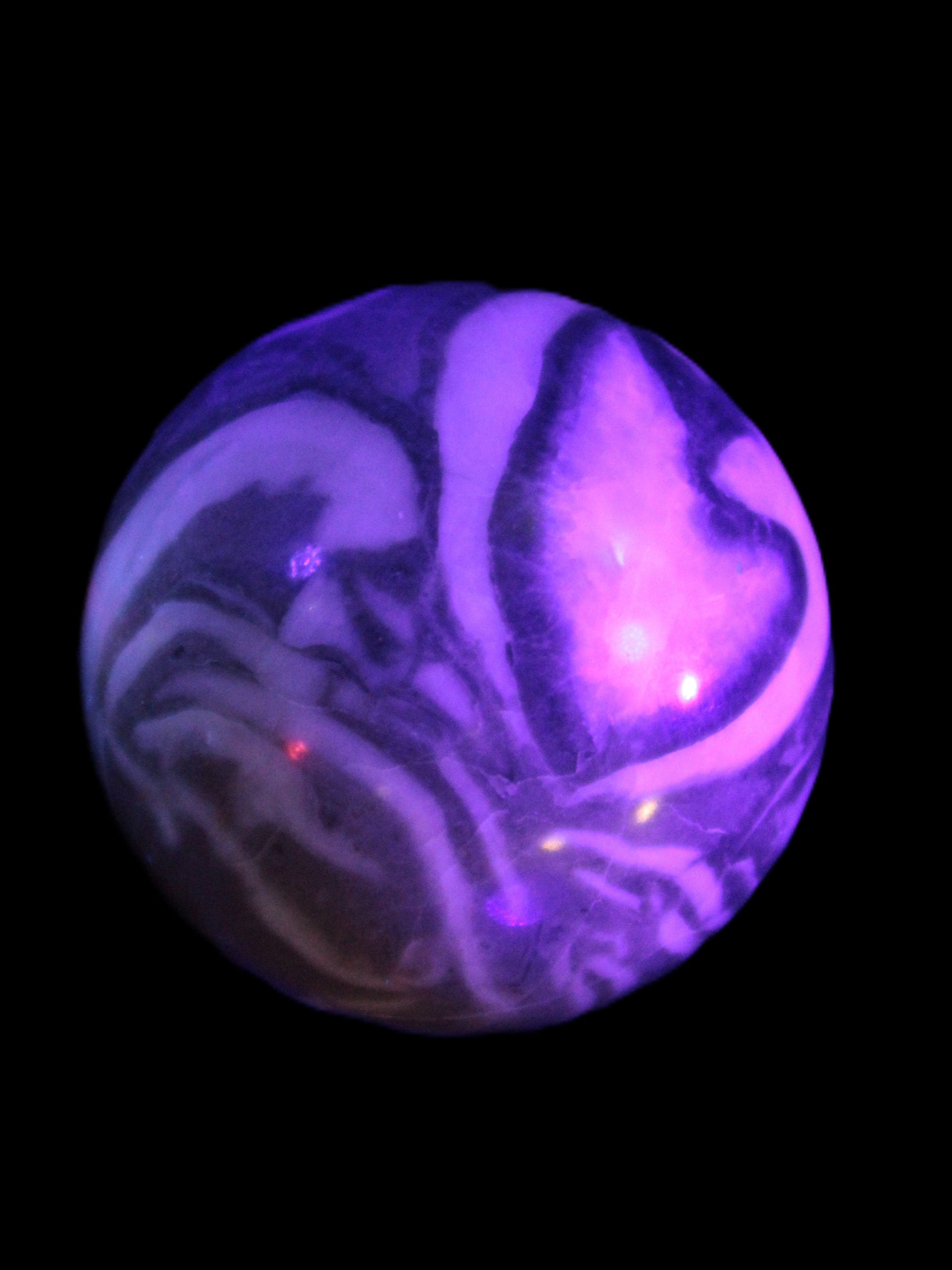 Thousand Eye Stone sphere 41mm 108g in UV light - Rocks and Things Store