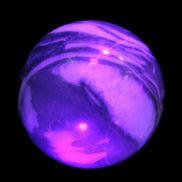 Thousand Eye Stone sphere 41mm 108g in UV light - Rocks and Things Store