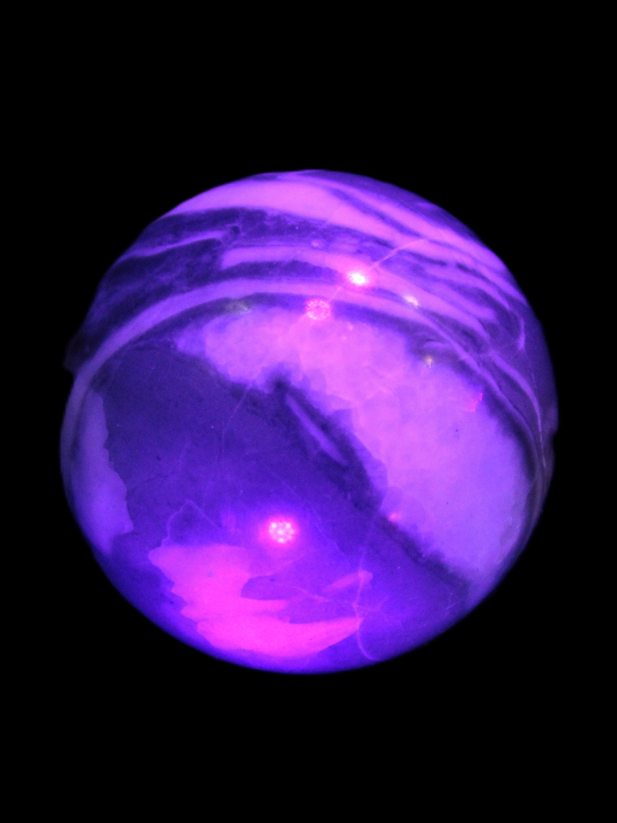 Thousand Eye Stone sphere 41mm 108g in UV light - Rocks and Things Store