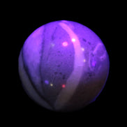 Thousand Eye Stone sphere 41mm 100g in UV light - Rocks and Things Store