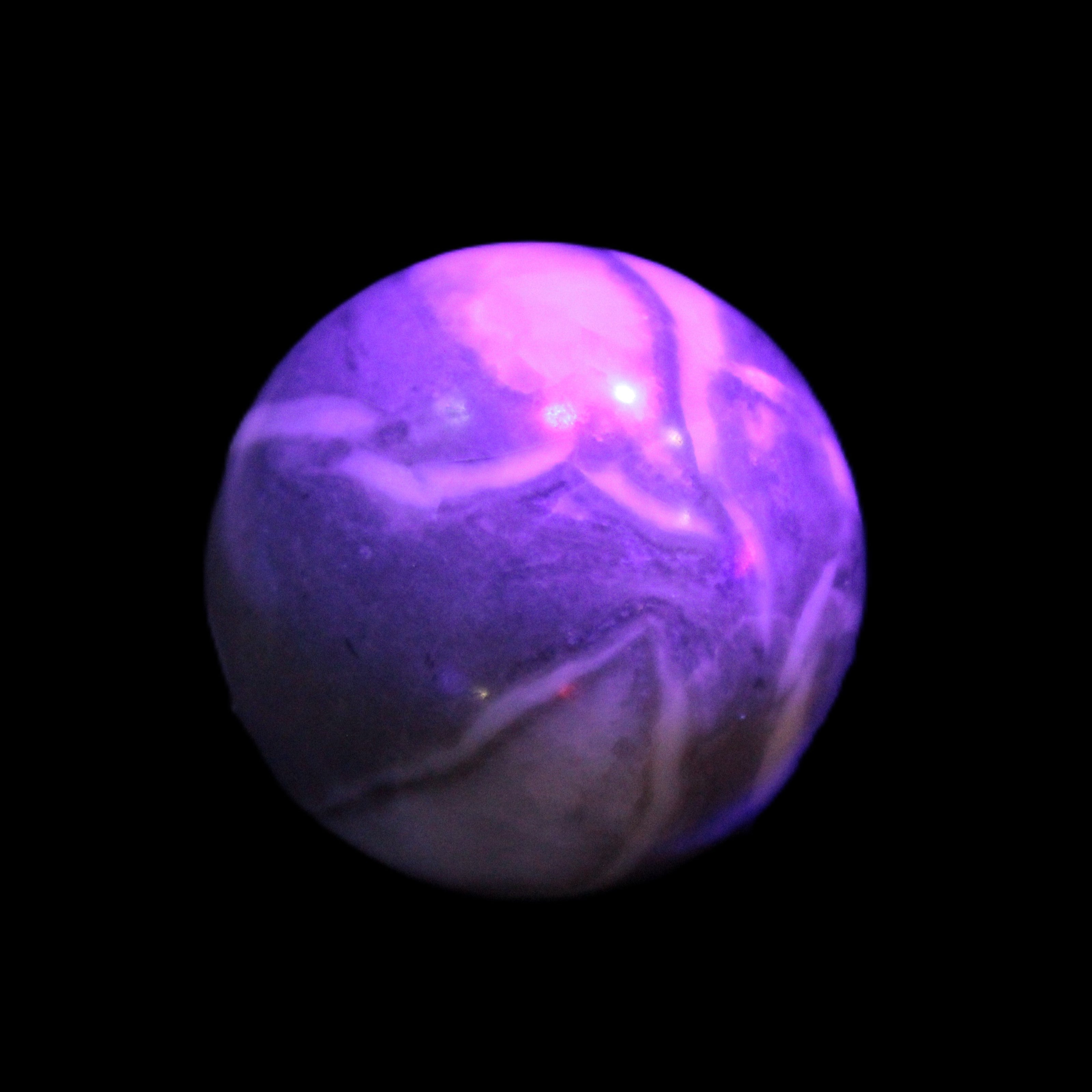Thousand Eye Stone sphere 41mm 100g in UV light - Rocks and Things Store