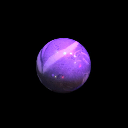Thousand Eye Stone sphere 41mm 100g in UV light - Rocks and Things Store