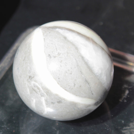 Thousand Eye Stone sphere 41mm 100g in sunlight - Rocks and Things Store