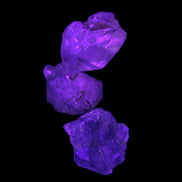 Super Seven Amethyst 3 crystals 12g in  UV light - Rocks and Things Store