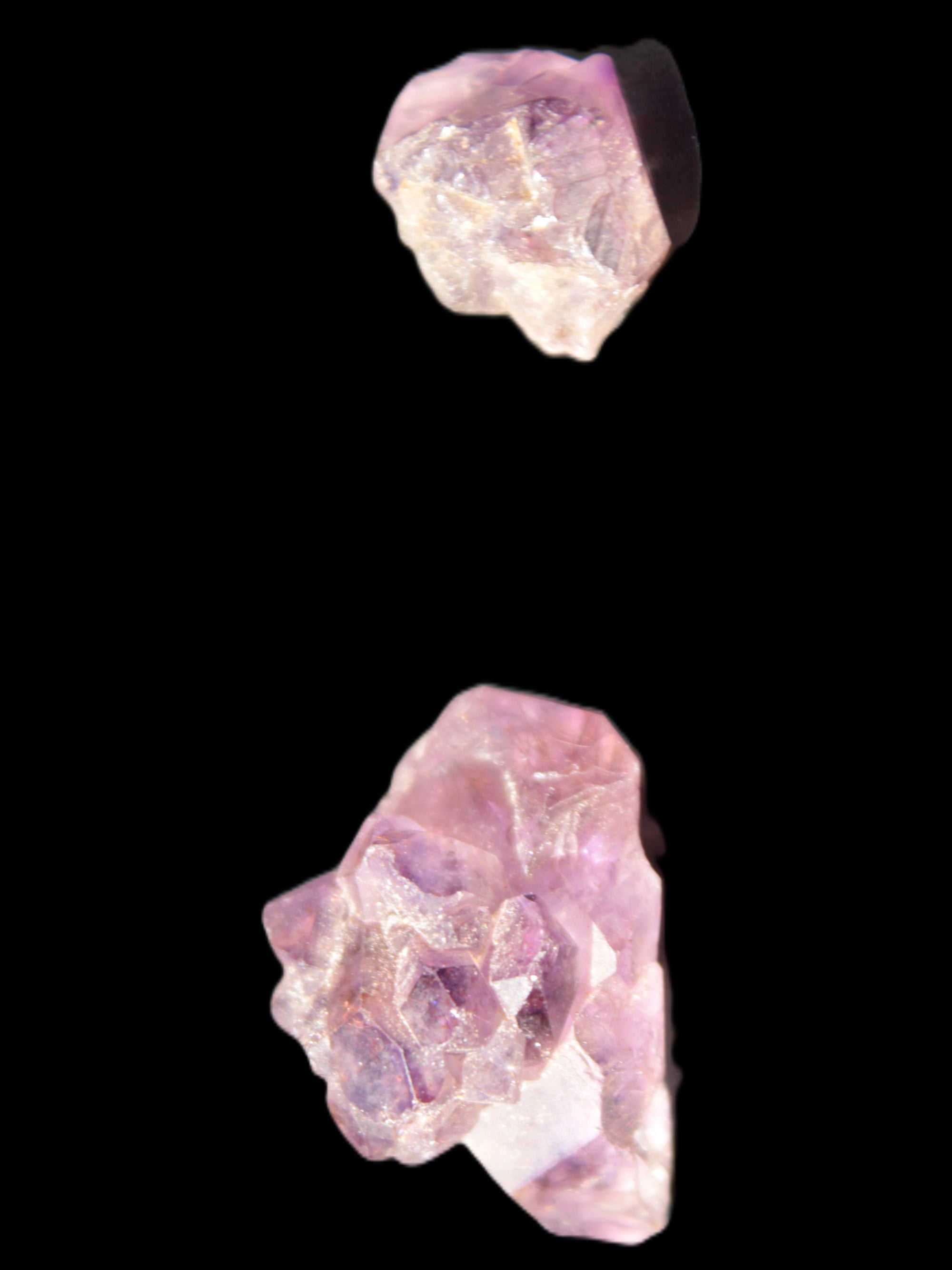 Super Seven Amethyst 2 crystals 11.1g in sunlight