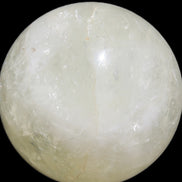 Citrine sphere 66mm 400g in bright sunshine