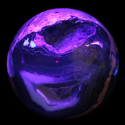 Volcano Agate sphere 119mm 2167g in UV light - Rocks and Things Store