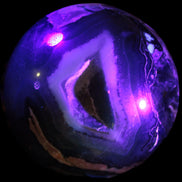 Volcano Agate sphere 119mm 2167g in UV light - Rocks and Things Store