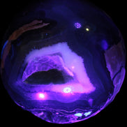 Volcano Agate sphere 119mm 2167g in UV light - Rocks and Things Store