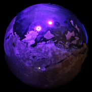 Volcano Agate sphere 119mm 2167g in UV light - Rocks and Things Store