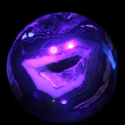 Volcano Agate sphere 119mm 2167g in UV light - Rocks and Things Store