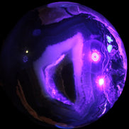Volcano Agate sphere 119mm 2167g in UV light - Rocks and Things Store