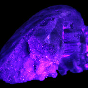 Sphalerite hand-carved skull 69*106*64mm 441g in UV light - Rocks and Things Store