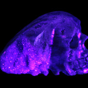 Sphalerite hand-carved skull 69*106*64mm 441g in UV light - Rocks and Things Store