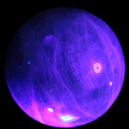 Green Fluorite sphere 108mm 2056g in UV light - Rocks and Things Store