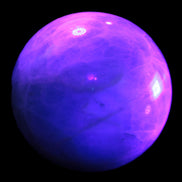 Green Fluorite sphere 108mm 2056g in UV light - Rocks and Things Store