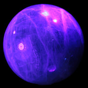 Green Fluorite sphere 108mm 2056g in UV light - Rocks and Things Store