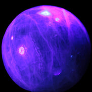 Green Fluorite sphere 108mm 2056g in UV light - Rocks and Things Store