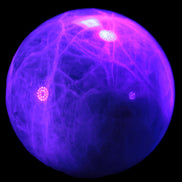 Green Fluorite sphere 108mm 2056g in UV light - Rocks and Things Store