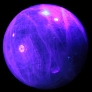 Green Fluorite sphere 108mm 2056g in UV light - Rocks and Things Store