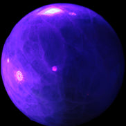 Green Fluorite sphere 108mm 2056g in UV light - Rocks and Things Store