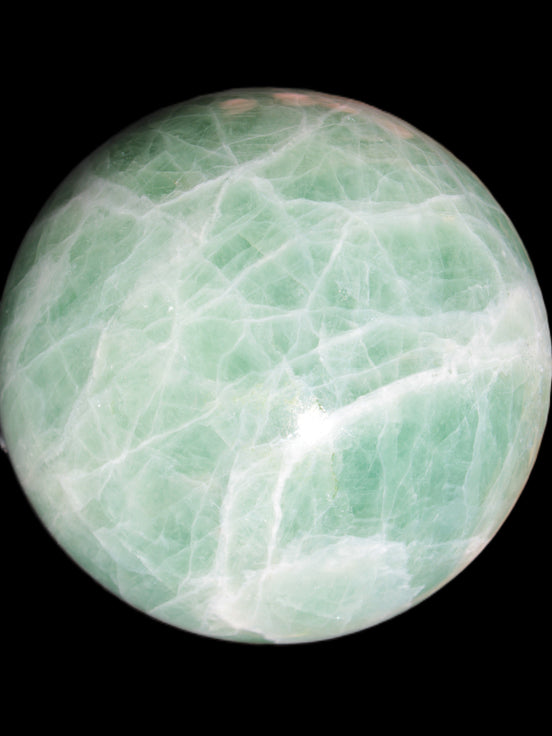 Green Fluorite sphere 108mm 2056g in sunlight - Rocks and Things Store