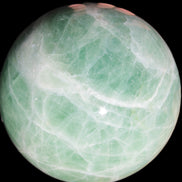 Green Fluorite sphere 108mm 2056g in sunlight - Rocks and Things Store