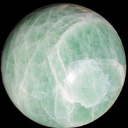 Green Fluorite sphere 108mm 2056g in sunlight - Rocks and Things Store