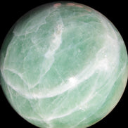 Green Fluorite sphere 108mm 2056g in sunlight - Rocks and Things Store