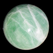 Green Fluorite sphere 108mm 2056g in sunlight - Rocks and Things Store