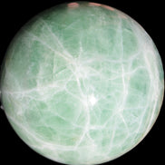 Green Fluorite sphere 108mm 2056g in sunlight - Rocks and Things Store