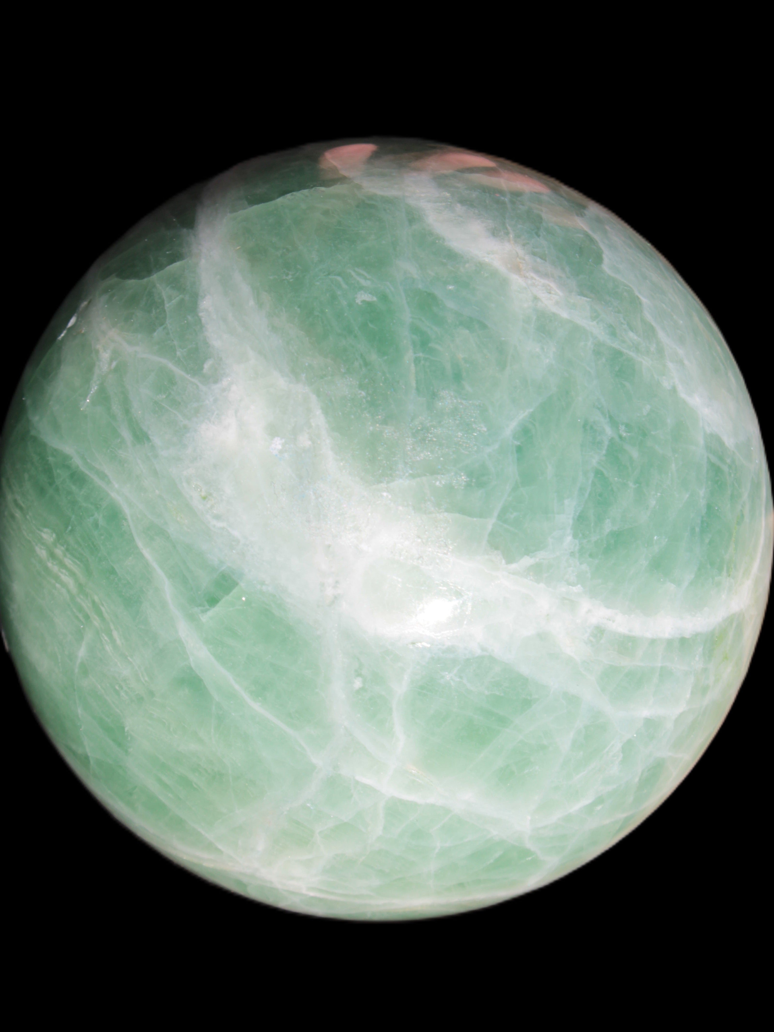 Green Fluorite sphere 108mm 2056g in sunlight - Rocks and Things Store